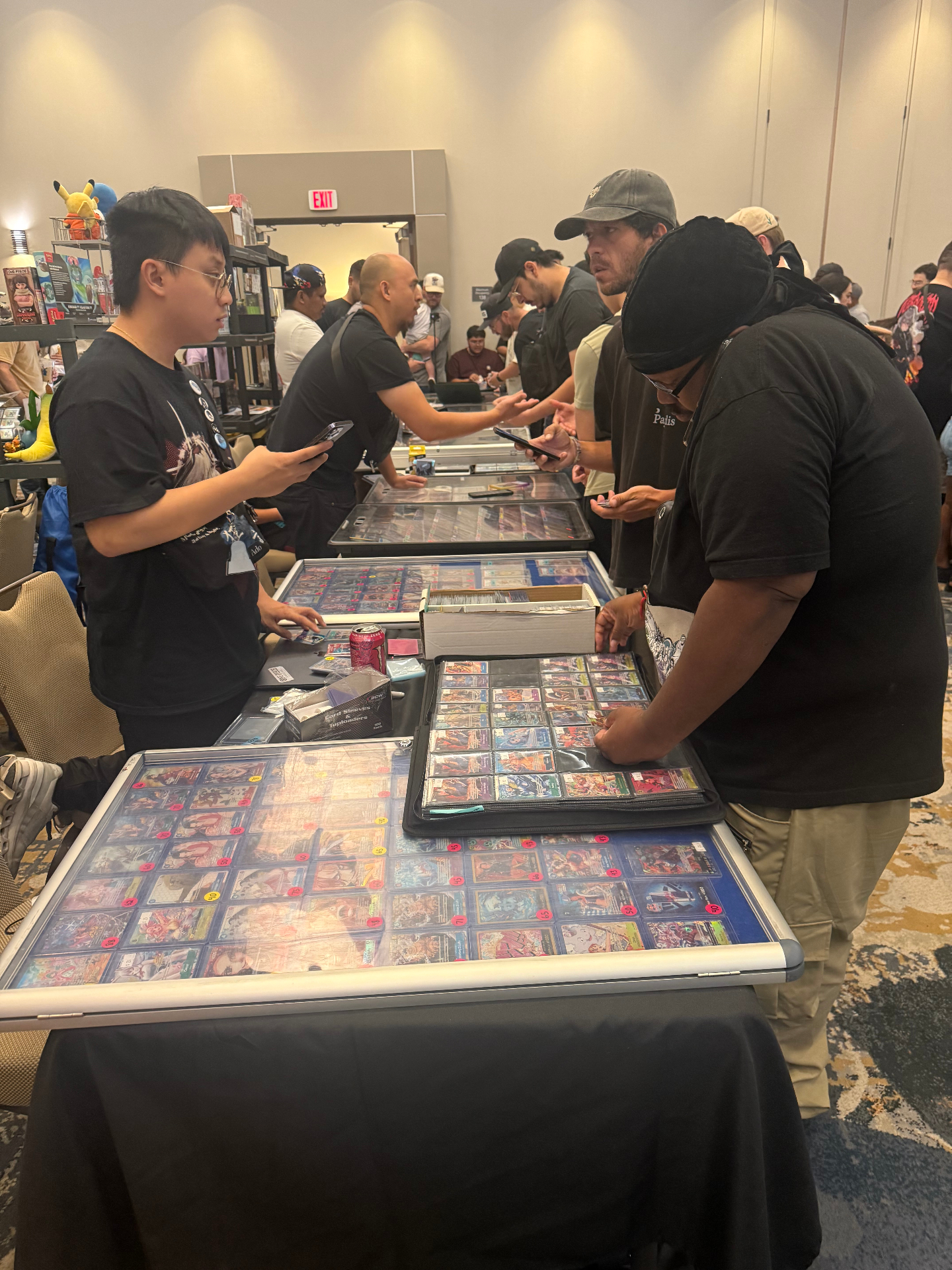Collectors making deals across display cases at The Cactus card show